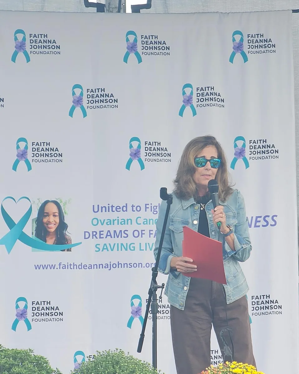 Speaker at a branded event backdrop